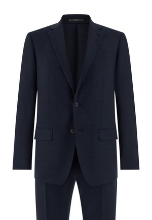 Veste de costume pour homme bleu marine à deux boutons, avec revers crantés, poches à rabat et une poche poitrine passepoilée, présentée sur un fond blanc.