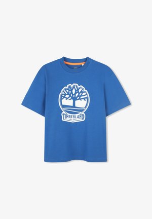 T-shirt in cotone blu con logo di un albero bianco e il testo "Timberland Established 1973". Design a maniche corte e collo rotondo.