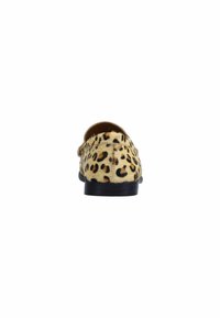 Loafer shoe seen from the back with tan and black leopard print fur upper and black sole on white background.