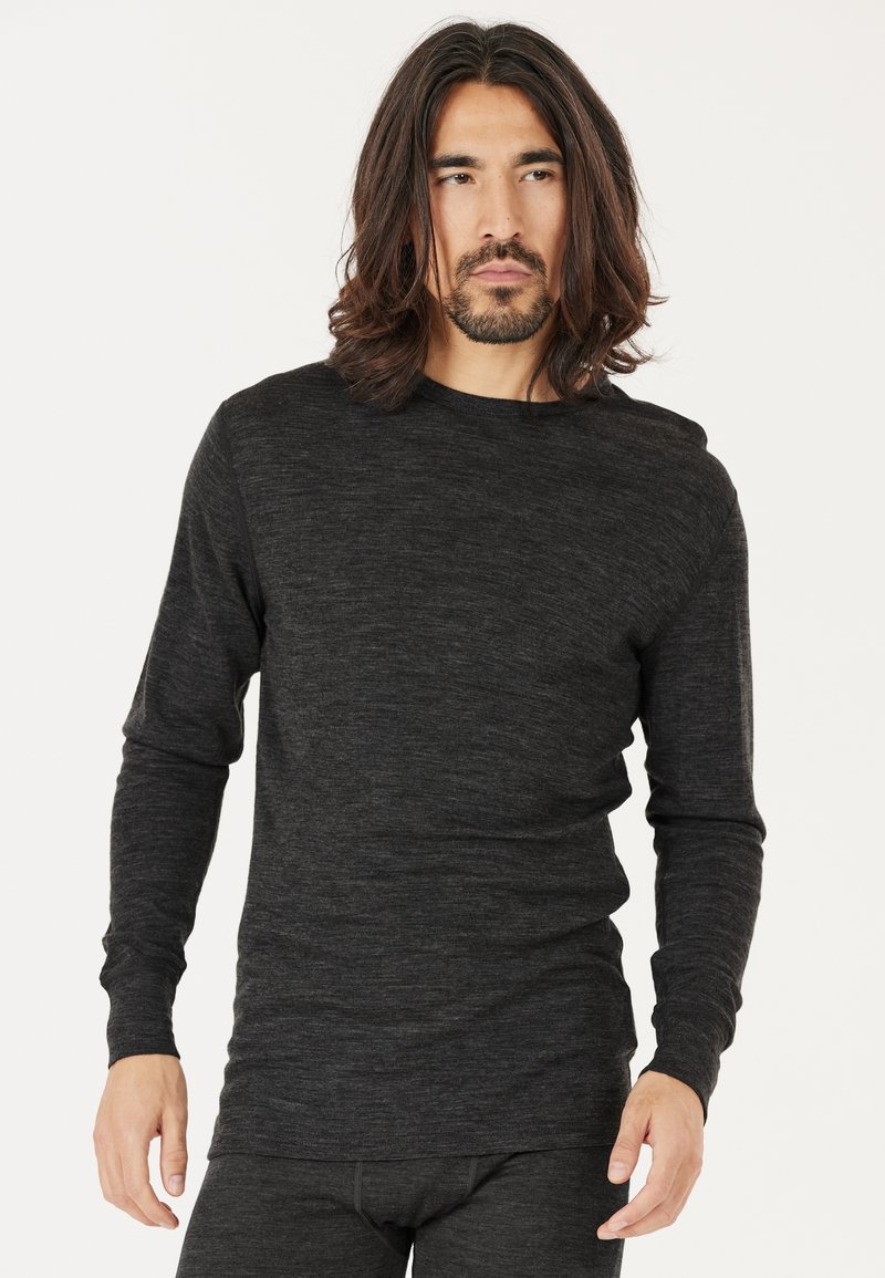 Schwarzes langärmliges Thermoshirt aus weichem, strukturiertem Stoff. Mit Rundhalsausschnitt und tailliertem Schnitt, mit glatter Oberfläche.