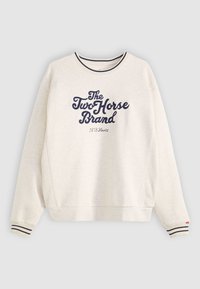 Lichtbeige sweatshirt met marineblauwe logotekst, gestreepte ribgebreide manchetten en een ronde halsontwerp. Gemaakt van zachte stof en heeft een relaxte pasvorm.