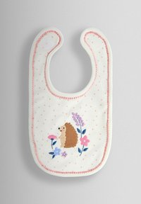 Biely podbradník s ružovými bodkami, lemovaný ružovým lemom. Obsahuje vyšívaného ježka a farebné kvety v modrej, ružovej a fialovej farbe.