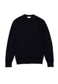 Marinblå stickad tröja, räfflad rund hals, långa ärmar, enfärgad, har en liten logotyp på bröstet, mjuk textur och åtsittande fåll och muddar.