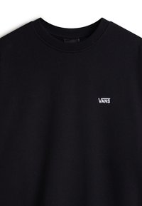 Felpa nera realizzata in tessuto morbido. Presenta un collo rotondo e un logo bianco "VANS" sul petto. Design semplice e pulito senza fantasie.