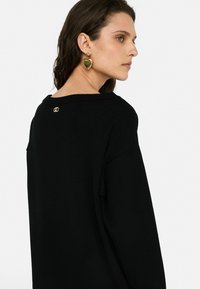 LIU JO KURZES - Abito in maglia - black