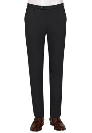 Black dress pants with a straight-leg design, featuring belt loops and a button closure. Worn with brown lace-up shoes.