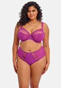 Purple lingerie set featuring a bra with sheer paneling and floral embroidery. High-waisted briefs with matching embroidery detail.