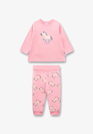 Pink two-piece pajama set featuring a long-sleeve top with a zebra graphic and matching pants with a zebra pattern. Soft cotton material.