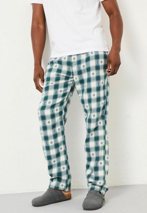 Karo-Hosen in Grün und Weiß mit kleinen blauen Blumenmustern. Aus weichem Stoff gefertigt, mit lässigem Schnitt und elastischem Bund.