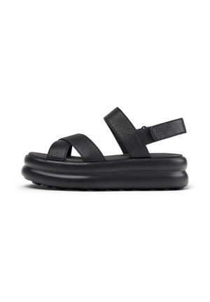 Black leather platform sandals featuring crisscross straps, a cushioned sole, and an adjustable back strap for secure fit.
