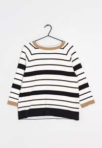 Gestreepte trui met lange mouwen, met afwisselende zwarte en witte strepen, en een beige geribde halslijn en manchetten. Zachte stoftextuur.