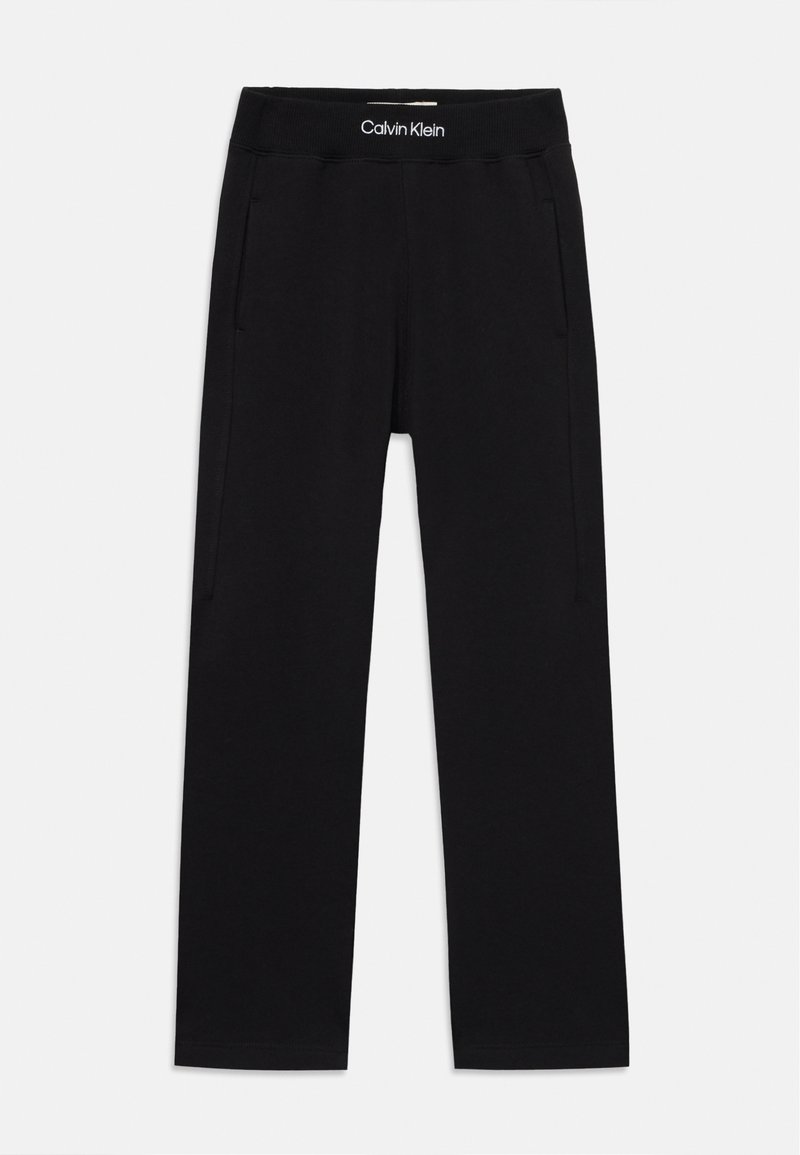 Pantalones de chándal negros de Calvin Klein con cintura elástica, dos bolsillos laterales y un acabado de tela de algodón suave. Diseño casual de pierna recta.