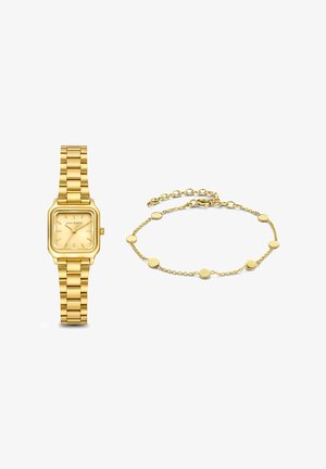 Goldfarbene Uhr mit quadratischem Ziffernblatt und Gliederarmband, daneben ein zartes goldfarbenes Armband mit runden Gliedern.