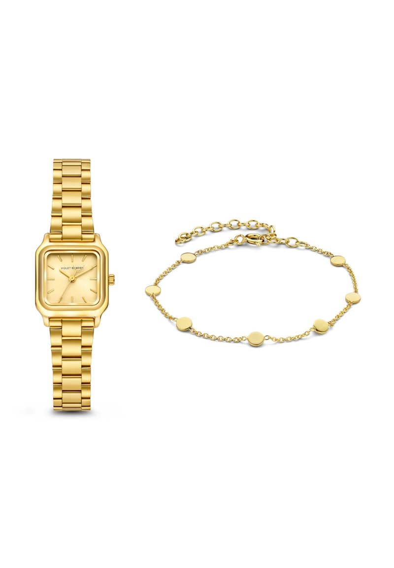 Goldfarbene Uhr mit quadratischem Ziffernblatt und Gliederarmband, daneben ein zartes goldfarbenes Armband mit runden Gliedern.