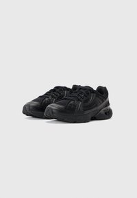 Black chunky sneakers with textured mesh and leather panels, thick cushioned soles, and black laces, shown on a plain white background.