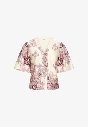 Blouse à manches courtes avec col en V, présentant une base crème et des motifs cachemire complexes en rose et violet.