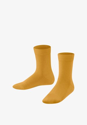 Zwei Paare senfgelbe Socken, die nebeneinander ausgestellt sind, mit einem gerippten Bündchen und einer glatten Oberfläche.