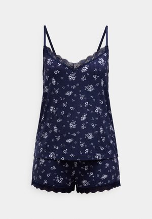 Tamsiai mėlynos spalvos gėlių rašto pižamos komplektas, kuriame yra berankovė palaidinė su nėrinių apdaila ir derančios šortai su banguotais kraštais. Minkšta audinio tekstūra.