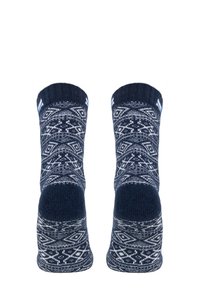 Marineblaue Socken mit einem weißen geometrischen Muster, ausgestattet mit einem gerippten Bündchen und verstärkter Ferse, gefertigt aus weichem Strickmaterial.