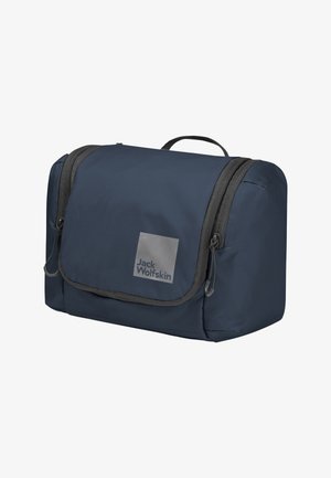 Trousse de toilette rectangulaire bleu foncé avec deux compartiments zippés, une poignée de transport, et un logo Jack Wolfskin sur le rabat avant.