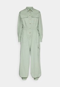 Jumpsuit verde claro con mangas largas, dos bolsillos en el pecho, cintura elástica y puños ajustados. Hecho de una tela suave y ligera. Detalles de botones.