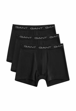Drei schwarze Boxershorts für Männer übereinander gestapelt, jede mit einem schwarzen Bund, auf dem das GANT-Markenlogo in Weiß angezeigt wird.