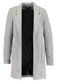 Grijze, textuur rijke lange blazer met een schalkraag, open voorkant en twee voorvakjes. Van binnen is het gemaakt van zwart, effen stof.