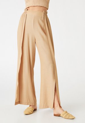 ELASTIC WAIST FLARED SLIT - Pantaloni - brown
