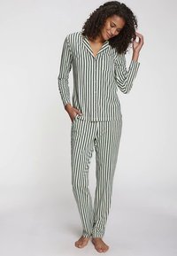 Green and white striped pajama set with long sleeves, button closure, chest pocket, and elastic waistband. Soft fabric with a comfortable fit.