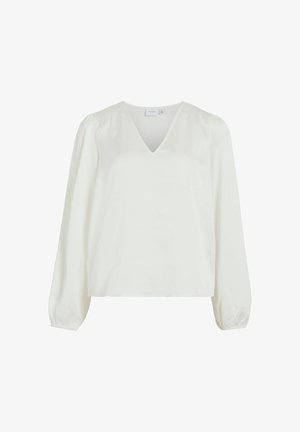 Blouse blanche avec un décolleté en V, des manches bouffantes longues et des détails smockés sur les épaules. Tissu lisse avec une coupe décontractée, sans motifs visibles.