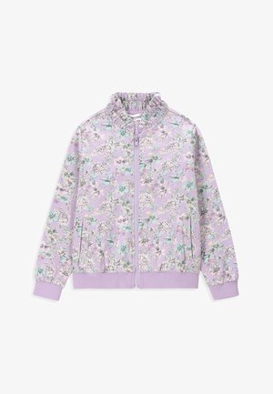 Veste zippée lilas avec taille et poignets élastiques, col à volants et motif floral en blanc, sarcelle et beige.