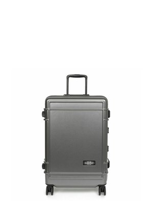 Gray hard-shell suitcase with a textured finish, telescoping handle, and four smooth-rolling wheels; features a brand logo at the bottom.
