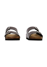 Sandales en cuir brun avec deux boucles réglables, semelle en liège et semelle en caoutchouc noir. Design ouvert aux orteils avec une texture lisse.