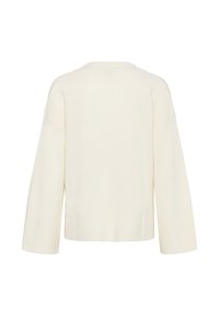 Pull en crème avec une coupe ample, des épaules tombantes, des poignets et un ourlet côtelés, fabriqué en matière tricotée douce. Texture unie, sans motifs ni accents.
