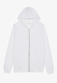 Sweat à capuche blanc zippé intégral avec cordon à la capuche, poches kangourou à l’avant, et poignets et ourlet côtelés, posé à plat sur fond blanc.