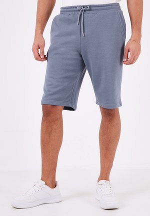 Pantaloni corti grigi fino al ginocchio realizzati in morbido misto cotone, con vita elasticizzata e coulisse, tasche laterali e una vestibilità comoda.