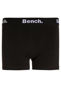 Fekete pamut boxer alsónadrág sima textúrával. Széles gumis derékpánttal rendelkezik, rajta fehér "Bench." logóval. Egyszerű kialakítás, minta nélkül.