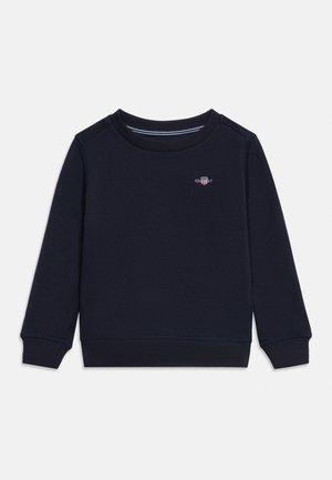 Felpa blu navy a manica lunga con scollo girocollo, polsini e orlo a costine, con piccolo logo GANT sul petto.