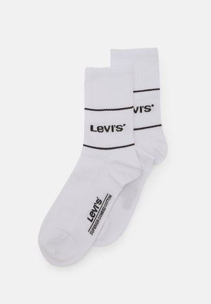 Valged puuvillased sokid mustade triipudega. Küljel on "Levi's" logo. Siledat tekstuuri, standardpikkus ja hästi vormitud kuju.