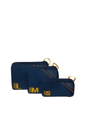 Three navy blue zippered packing cubes in small, medium, and large sizes with yellow pull tabs and size labels.