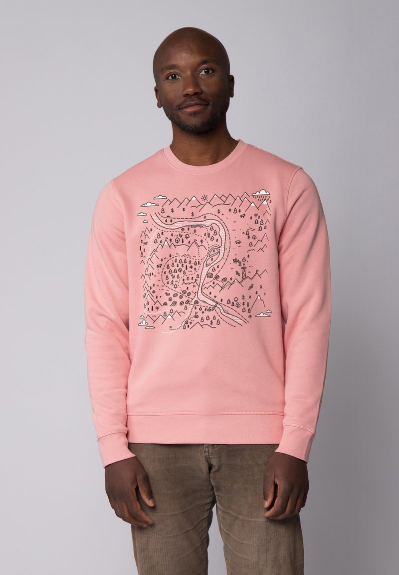Sweat-shirt rose avec un design en contour noir représentant des montagnes, une rivière et des arbres. Manches longues et col rond. Tissu en mélange de coton doux.