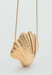 Golden shell-shaped handbag with a textured surface and a chain strap, featuring ridged details and a clasp closure.