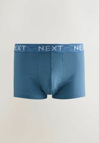 Boxers bleus pour hommes en tissu doux, dotés d'un design sans couture et d'une ceinture contrastante avec le logo "NEXT" en blanc.