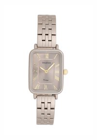 Montre rectangulaire beige avec un bracelet en maille métallique, dotée d'un cadran doré, de chiffres romains et d'une couronne dorée. Texte "OOZOO Vintage" affiché.