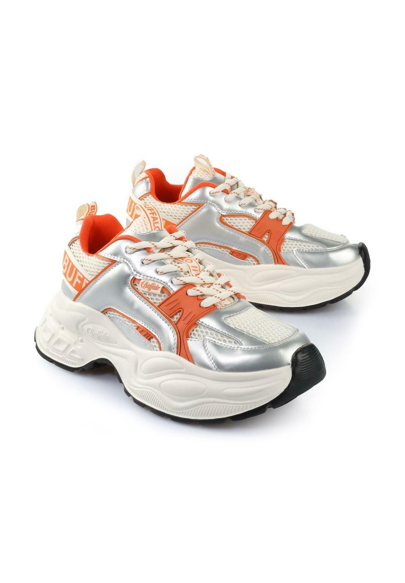 Silver sneakers with orange accents, mesh and synthetic material, padded collar, thick white sole, and reflective detailing on the sides.