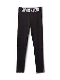 Leggings pretos com um logo branco "CALVIN KLEIN" na cintura. Material suave, design ajustado, com detalhes em malha nos tornozelos.