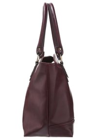 Sac à main en cuir bordeaux foncé avec doubles poignées et garnitures dorées, présenté de profil sur un fond blanc.