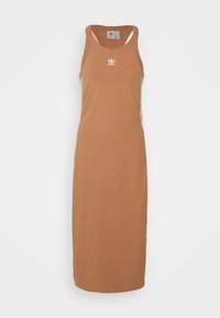 Tan midjeklänning utan ärmar i bomull, med rund halsringning, sidosträck och en Adidas-logotyp på bröstet. Lång och figurnära.