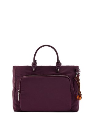 Ciemnofioletowa torebka z przednią kieszenią na zamek, okrągłymi uchwytami oraz dekoracyjnym brązowo-pomarańczowym sznurkiem przymocowanym do bocznego pierścienia.