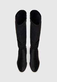 Black knee-high boots with a smooth texture and pointed toe. Features a zip closure on the side and a soft inner lining.